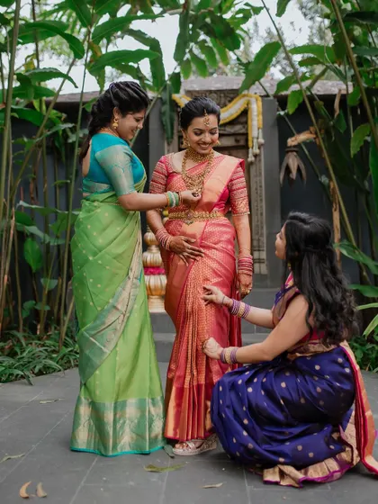 A bride surrounded by her bridesmaids, a beautiful moment of friendship and support. We capture the special bond between the bride and her closest friends.