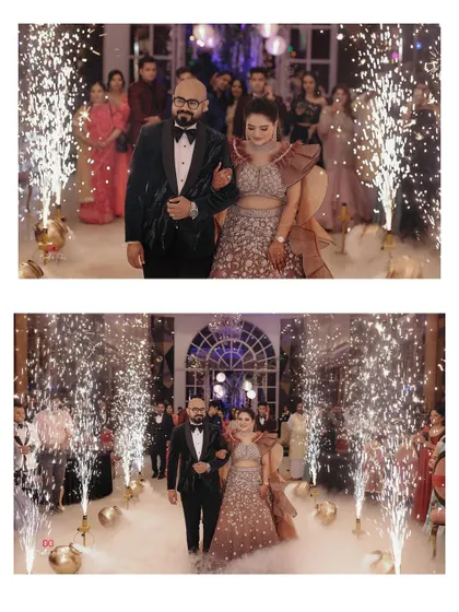 The couple's grand entrance framed by cold pyro fireworks, creating a spectacular and memorable moment at their engagement celebration.