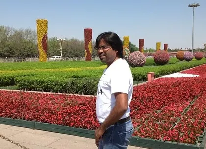 This photo was taken during a trip to China, in front of a massive public square filled with formal flower beds and topiaries. It's amazing to see how different cultures use plants in public spaces.