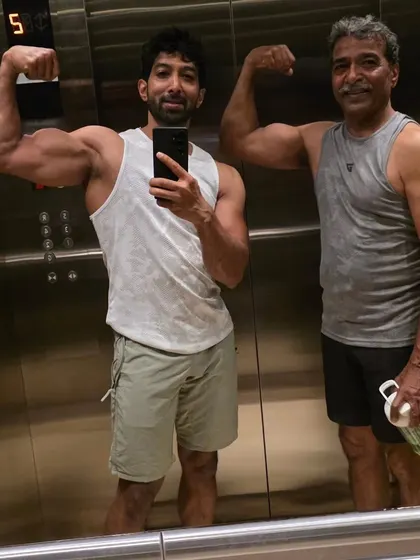 A post-workout selfie with my dad in the elevator. We make sure to get our training in, no matter what. This is the kind of consistency I teach.