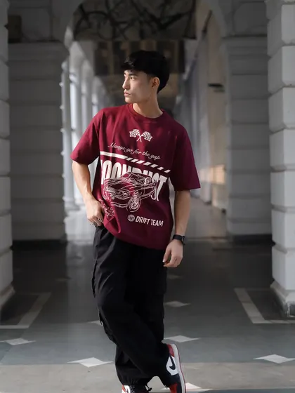 This pose captures the model in motion, giving a sense of energy to the photograph. It's a great way to show apparel for an active, style-conscious audience.