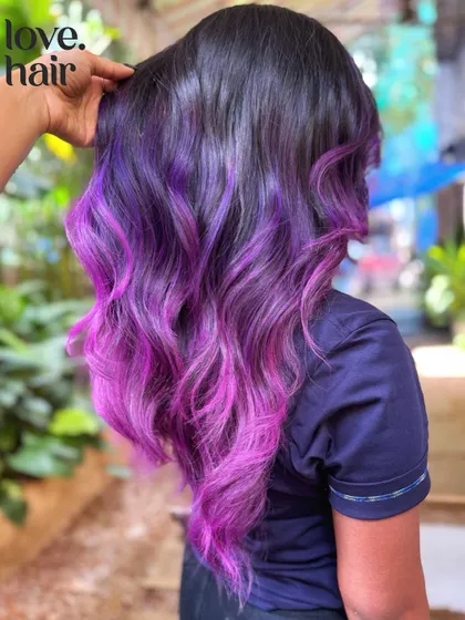 A stylist's hand showing the texture and flow of this stunning vivid color melt.