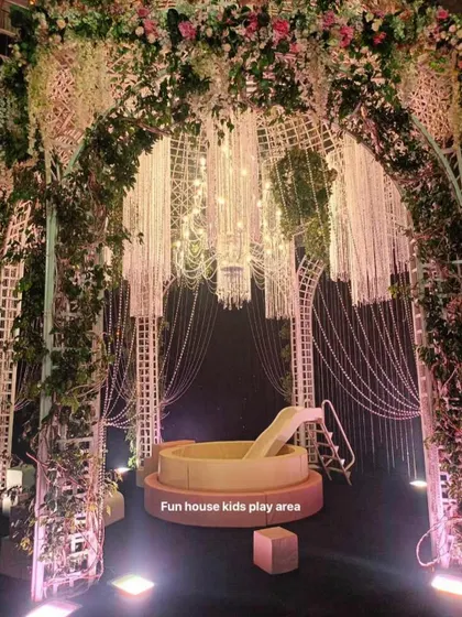 For a truly magical experience, we placed our white ball pit and slide under a stunning floral and crystal archway at a luxury event.