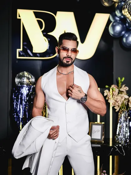 Another look at the all-white waistcoat and trousers. The fit is impeccable, designed to flatter the physique and create a powerful silhouette for a themed party or special event.