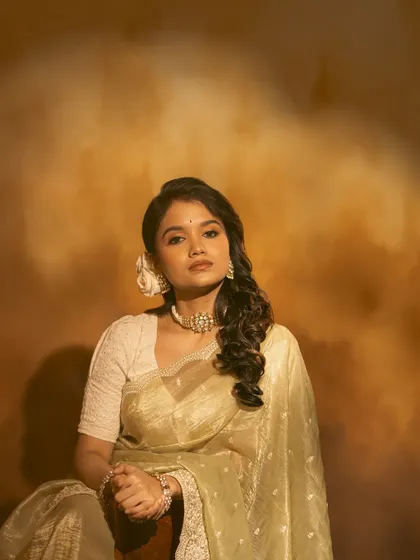 A collection of images from a retro-themed photoshoot with the beautiful actress Sanjana Tiwari. I created a soft, classic hairstyle with side-swept curls and floral accents to match the vintage aesthetic.