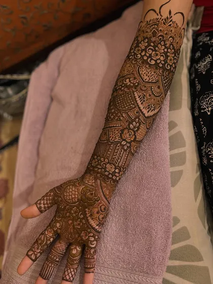 An engagement bridal henna design with a mix of floral and geometric patterns.