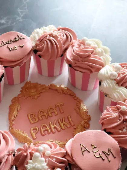 Another view of the engagement platter, showing the custom initial cookie (A&M) and another cupcake with "Mubarak ho" written on it.