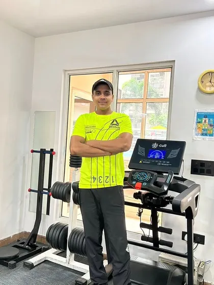 In a bright shirt, ready to train.