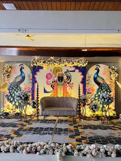 For a traditional Godh Bharai ceremony, I designed this stunning stage featuring Lord Krishna (Shrinathji) and peacock illustrations, blending cultural reverence with beautiful aesthetics.