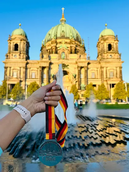 The Berlin Marathon medal with the beautiful Berlin Cathedral in the background. A perfect memento from an unforgettable race experience in a historic city.