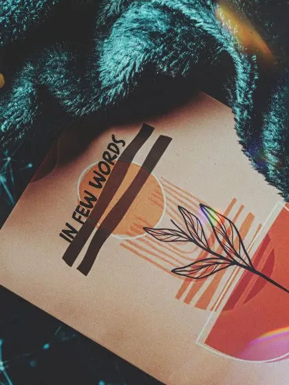 Creating a cozy and comfortable vibe for the book by pairing it with a soft blanket. The added light flare gives the image a dreamy, magical quality, perfect for a different kind of brand mood.