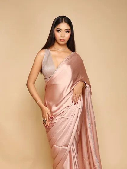 A clean, elegant shot for a saree brand against a seamless beige backdrop. This is a classic e-commerce setup that we can provide for any apparel business.
