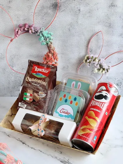 Looking for the perfect Easter gift? Our delightful Easter gift hampers are packed with delicious chocolates, candies, and other festive treats like Pringles and Loacker wafers.
