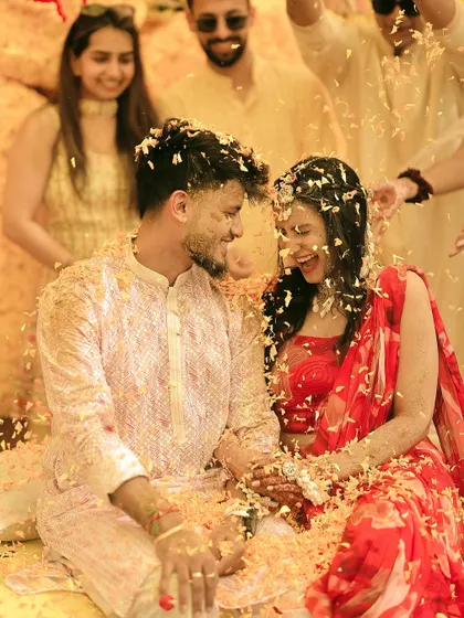 Another angle of the flower shower, capturing the couple's ecstatic laughter.