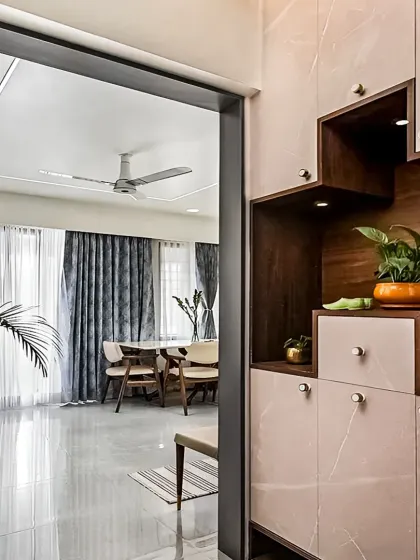 A view from the entryway into the living room, showcasing a custom shoe cabinet with display niches. This is how I make even practical furniture beautiful.