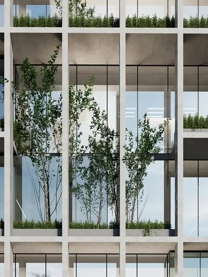 A detail of the facade for the Visakhapatnam office building. The deep-set windows and concrete grid provide passive shading, reducing heat gain while allowing ample natural light. The integrated planters bring greenery into the vertical plane of the building.