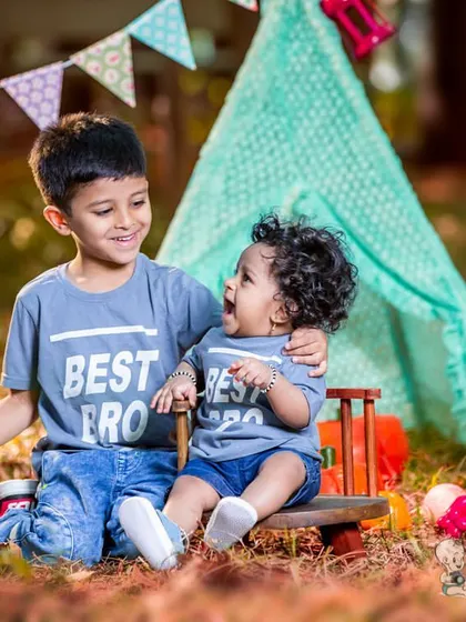 A duplicate of image 49, showing two brothers in "Best Bro" shirts sharing a happy moment outdoors. This photo perfectly captures the special bond between siblings.