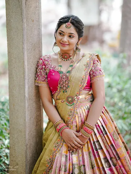 The combination of the pink embroidered blouse and the multi-toned silk skirt creates a unique and personal bridal look.