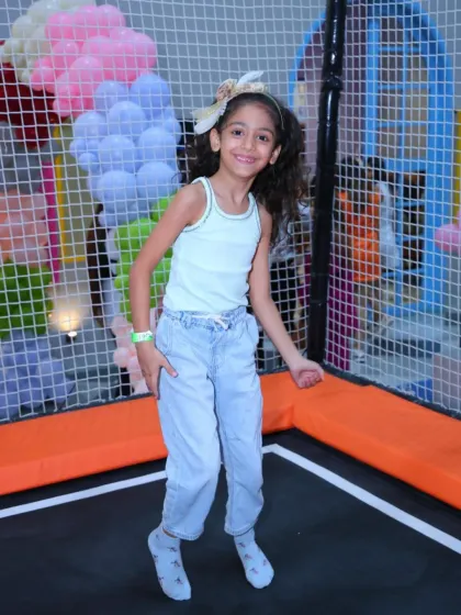 A joyful leap in the air shows the pure fun of our trampoline park. It's a great way for kids to express themselves and have fun.