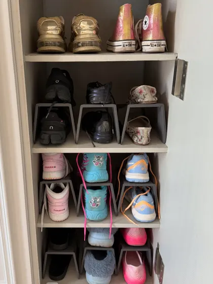 Even a small shoe cabinet can be highly efficient. These simple shoe stackers double the storage capacity, ensuring every pair from sneakers to flats has a home.