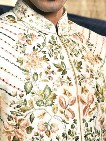 Every element, from the collar to the cuffs, is meticulously designed and embroidered to contribute to a cohesive and magnificent wedding ensemble.