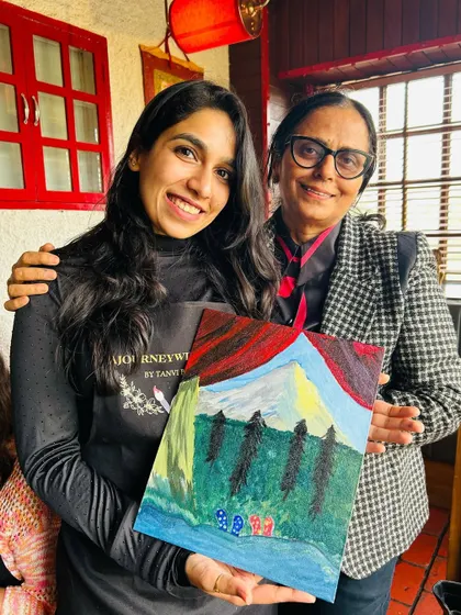 A lovely mother-daughter duo enjoying the painting session together. Art is a wonderful way to bond and create shared memories.
