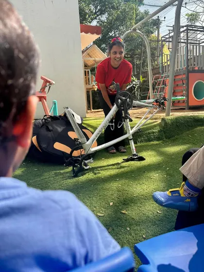 A moment of focused attention as the children listen to our guest speaker explain the mechanics of her racing bike. Real-world experts bring our themes to life in a powerful way.