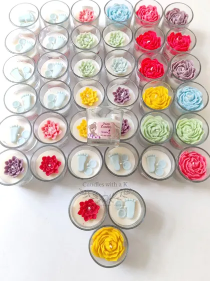 A wide shot of the assorted votive jar candles, showing the full range of designs available for birthday celebrations.
