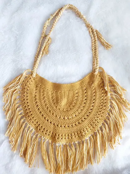 A flat-lay of another version of the Callaia Bag, showing how different yarn colors can change the look.