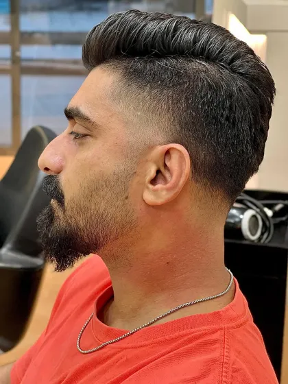 A side profile of the classic fade, showcasing the clean taper and voluminous top.