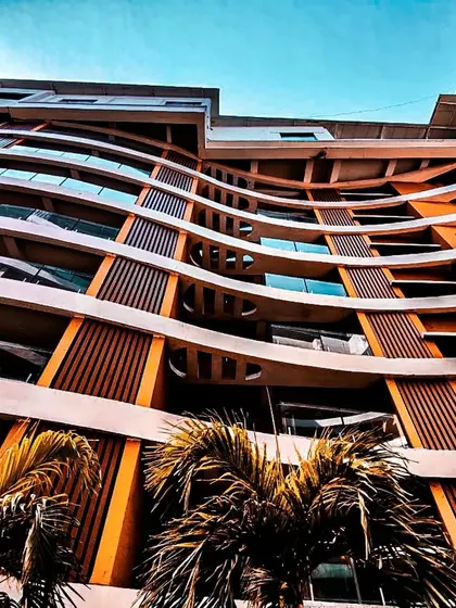 An upward-looking shot of the curved balconies at the Palm Bellagio project.