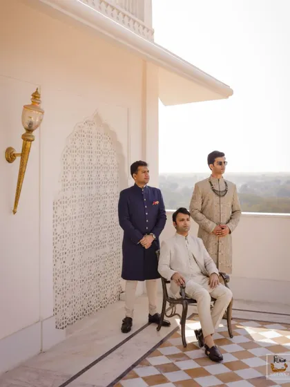 A stylish portrait of the groom and his groomsmen on a palace balcony in Jaipur.