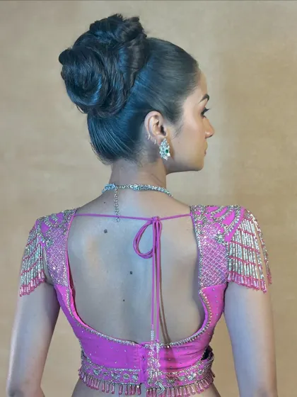 Another angle of the high braided bun, a true work of hair art.