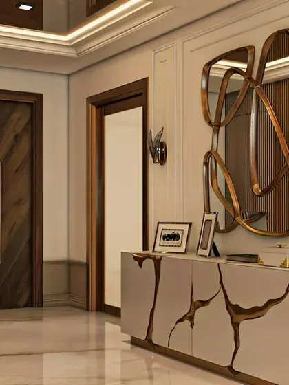 A luxurious entryway console that could also serve as a grand dressing unit. The cabinet features a unique cracked-gold design, paired with an abstract mirror and artistic wall sconces.