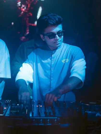 A focused shot of me at the decks. It's all about reading the room and selecting the perfect next track.