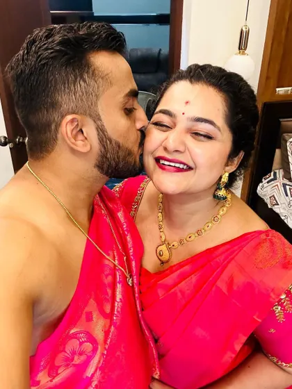 The best part of my job is seeing the joy my designs bring. This beautiful, candid moment captures the happiness of the occasion.