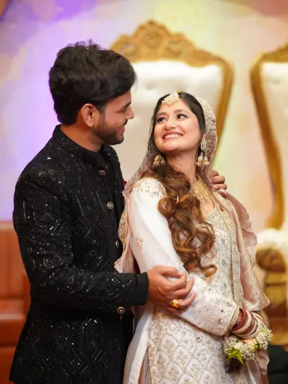 A romantic portrait of the couple looking at each other. The bride's beautiful smile and the groom's loving gaze are perfectly captured.