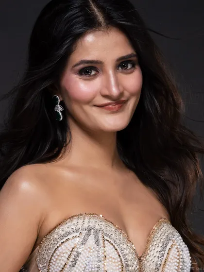 A warm, smiling portrait of the pageant contestant, capturing her personality and radiance. A good portfolio needs a mix of serious and smiling shots.