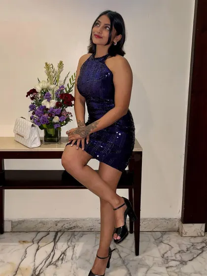 For my birthday celebration, I chose this sparkling blue sequined halter dress. It's a fun and glamorous party dress that's perfect for a special occasion.