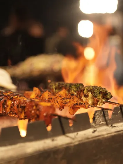 There is nothing quite like the aroma of live barbecue. We grill skewers of marinated vegetables and paneer over hot coals, ensuring each bite is infused with a perfect char and smoky flavour.