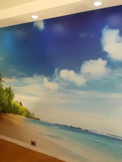 This expansive tropical beach mural instantly creates a relaxing, vacation-like feel. It's a fantastic way to open up a room and provide a calming escape, perfect for waiting rooms or stressful office environments.