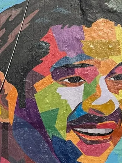 A colorful, abstract portrait of Sachin Tendulkar, celebrating the cricket legend who hails from Dadar.