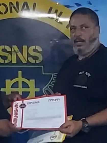 Receiving my Krav Maga diploma from my master, Vicky Kapoor, in Delhi.