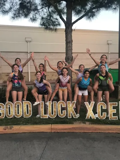 A fun, silly pose from our Xcel girls as they get ready to head to the State Championship.