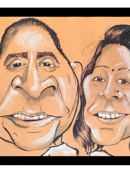 A beautiful couple caricature on toned paper, which adds a lovely warmth to the portrait.
