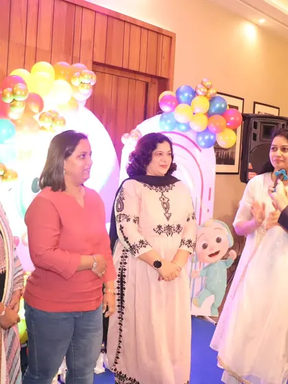 A candid moment of interaction with guests. I make sure to connect with everyone in the room.