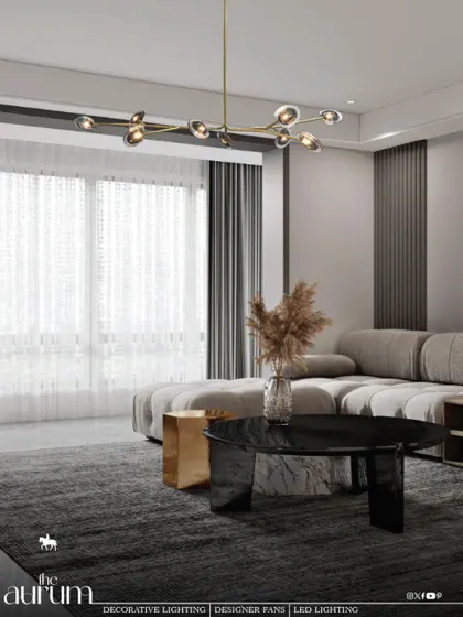 This linear, multi-bulb pendant introduces a sleek, contemporary element to a minimalist living room. Its design provides excellent light distribution over the seating area while maintaining a feeling of open, uncluttered elegance.
