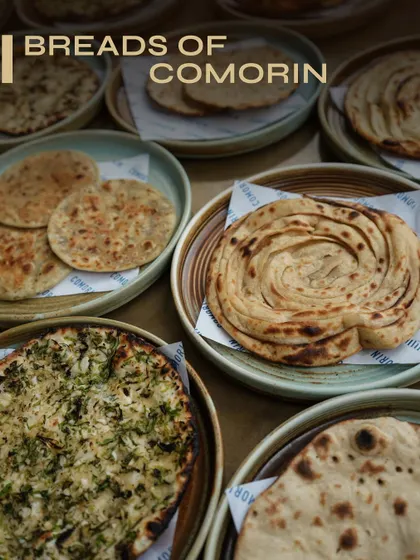 Round, flaky, crisp, or charred, our breads are crafted to be the perfect partner for any curry. This spread showcases the variety we offer, each one waiting to be torn, dipped, and devoured as you enjoy your meal.