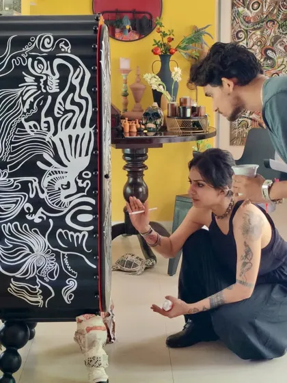 A look at our process, where ideas take physical form. Here, I am hand-painting the final details on a sculptural piece, working alongside my team to bring a client's story to life, one brushstroke at a time.