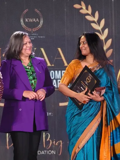 Sharing a smile with the presenters at the KWAA awards. These moments of recognition are cherished reminders of the long journey in the arts.